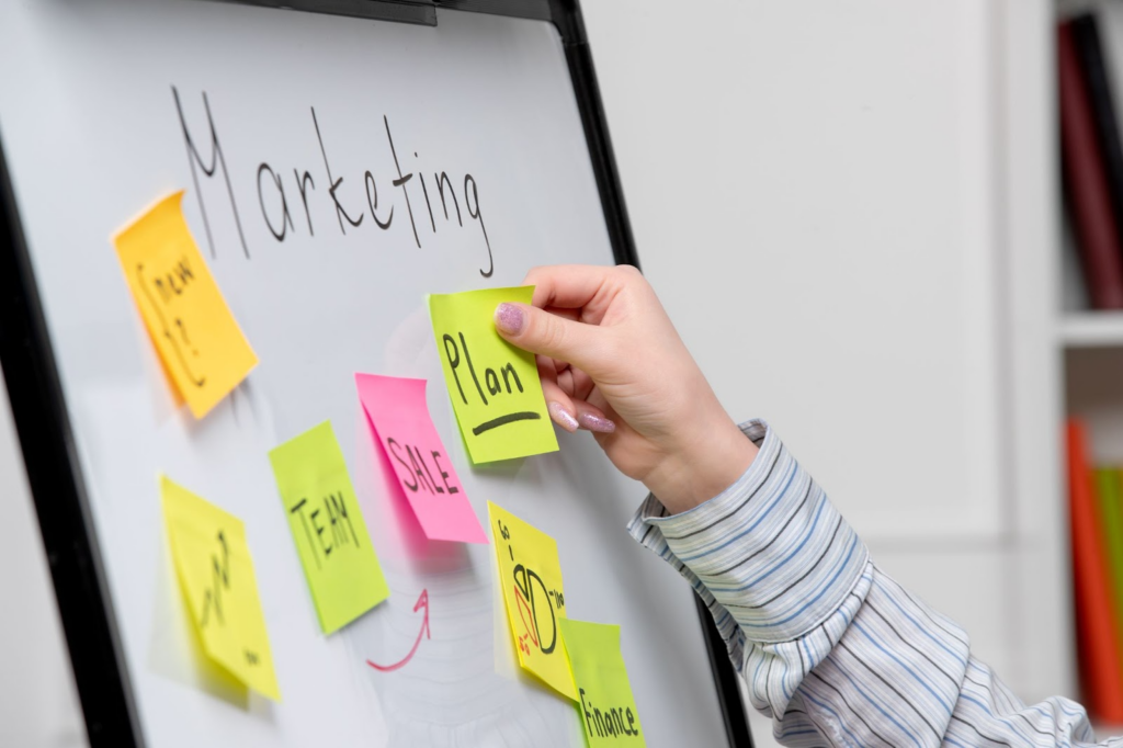 writing a marketing strategy on a white board